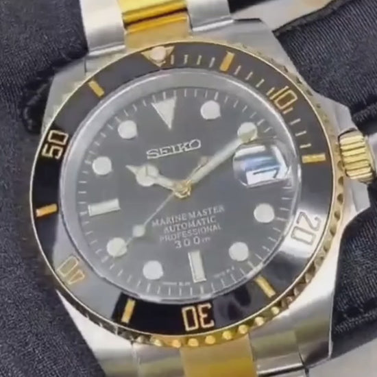 A Close Up Video of a Black Gold Seiko Mods Submariner with a Two-Tone Bracelet