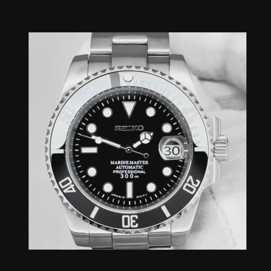 A Close up video of a Seiko Mod Black Submariner